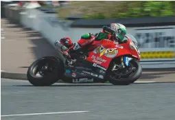  ??  ?? Glenn Irwin on his way to victory in the North West 200 Superbike race. Nikon D810, 200-500mm at 200mm, 1/100sec at f/13, ISO 64