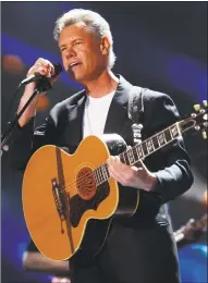  ??  ?? Randy Travis performs at the 2013 CMA Music Festival at LP Field in Nashville, Tenn., in 2013.