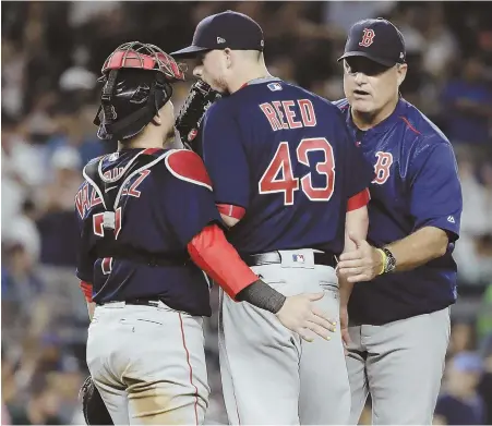  ?? AP PhoTo ?? REED IT AND WEEP: Red Sox manager John Farrell pulls reliever Addison Reed from the game in the eighth inning last night. Handed a three-run lead, Reed and Joe Kelly allowed five runs in a 5-4 loss to the Yankees.