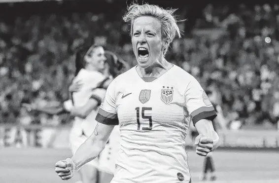  ?? Richard Heathcote / Getty Images ?? Forward Megan Rapinoe celebrates her second goal of the match against France on Friday. She has five goals in five Women’s World Cup matches.