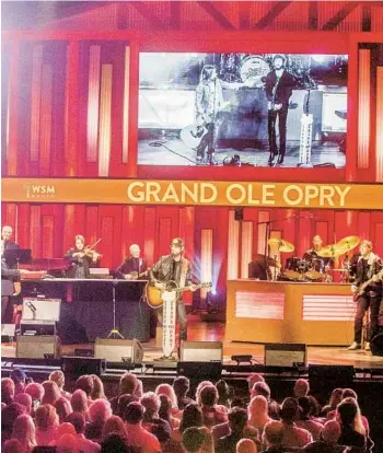  ?? KYLE DEAN REINFORD NEW YORK TIMES PHOTOS ?? Chris Janson performs at the Grand Ole Opry during its 5,000th broadcast in Nashville, Tenn.