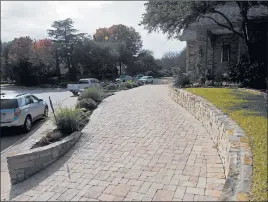  ?? BENNY SNYDER/AP ?? More homeowners and communitie­s are opting for permeable paving options that lessen runoff. When runoff overwhelms water-treatment facilities, it can pollute waterways.