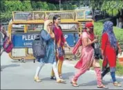  ?? PTI ?? Students return to the Banaras Hindu University after it reopened on Tuesday.