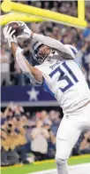  ?? AP FILE ?? After Tennessee’s Kevin Byard made this intercepti­on against Dallas on Nov. 5, he celebrated on the Cowboys’ midfield star.