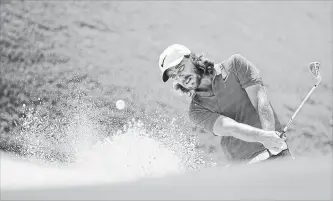  ?? ANDY LYONS GETTY IMAGES ?? Golfer Tommy Fleetwood of England plays a shot from a bunker during a practice round on Wednesday prior to the opening of the 2018 PGA Championsh­ip at Bellerive Country Club near St Louis, Mo.