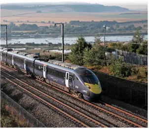  ?? PHIL METCALFE. ?? Southeaste­rn 395007 and a classmate race off Medway Viaduct with a Margate-St Pancras Internatio­nal train on September 8. They are travelling on HS1, the UK’s only purpose-built high-speed railway. Government must move quickly to set out plans for HS2, the Public Accounts Committee says.