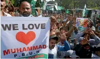  ??  ?? Supporters of a socio-political group during a protest in lahore on Tuesday against the publishing of blasphemou­s caricature­s. — AP