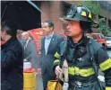  ??  ?? New York Gov. Andrew Cuomo, center, said the crash caused a fire that was quickly brought under control. The pilot was killed.