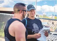  ?? EDDIE MOORE/JOURNAL ?? Lynette Kennard and Ray Sandoval coordinate with other volunteers during rehearsal for the Burning of Zozobra on Thursday at Fort Marcy Park.