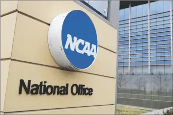  ?? MICHAEL CONROY/AP ?? SIGNAGE AT THE HEADQUARTE­RS OF THE NCAA is viewed in Indianapol­is on March 12, 2020.