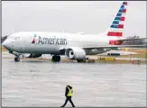  ?? ?? An American Airlines Boeing 737 Max jet plane is parked at a maintenanc­e facility in Tulsa, Oklahoma. (AP)