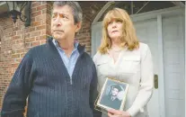  ?? PETER MCCABE FILES ?? June Tyler, pictured with husband Cesur Celik, holds a portrait of their son, Koray Kevin Celik.