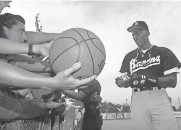  ?? AP FILE PHOTO ?? Playing with basketball legend Michael Jordan, right, had many benefits, his former teammates with Class AA Birmingham ( Ala.) in 1994 say. “It made you want to play harder,” Scott Tedder says. “It was like playing with a rock star.”