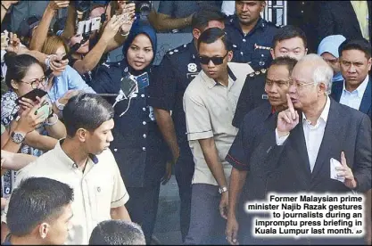  ?? AP ?? Former Malaysian prime minister Najib Razak gestures to journalist­s during an impromptu press briefing in Kuala Lumpur last month.