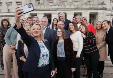  ?? ?? Selfie Féin: Michelle O’Neill takes a snap with her SF colleagues at Stormont yesterday