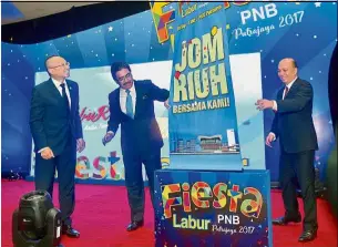  ??  ?? Johari with Permodalan Nasional Bhd (PNB) group chairman Tan Sri Abdul Wahid Omar (left) and PNB president and group chief executive Datuk Abdul Rahman Ahmad (right) during the launch of Fiesta Labur PNB 2017 event in Putrajaya. — Bernama New...