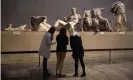  ?? Photograph: Matt Dunham/AP ?? Visitors to the British Museum, London, stand before part of the Parthenon marbles, which were taken by Lord Elgin from Athens more than two centuries ago.