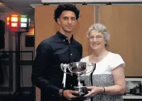  ??  ?? ●●Player Of The Season Lewis Montrose receives his award from Angela White