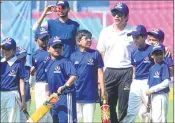 ?? PIC/BL SONI ?? Indian cricket legend Tendulkar (R) takes part in a teaching session with young cricketers at DY Patil Stadium on Thursday.