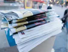  ?? TYLER ANDERSON/Postmedia News file photo ?? Nearly 80 per cent of Canadians say they pick up a physical newspaper or visit a paper’s website at least once a week, new surveys have found.