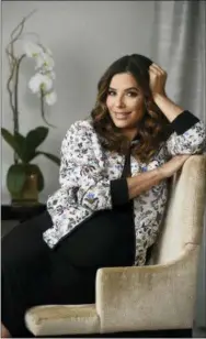  ?? PHOTO BY CHRIS PIZZELLO — INVISION — AP ?? Actress Eva Longoria’s spring line features ruffled sleeves, graphic tees, floral patterns and feminine pleated skirts meant to be dressed up for work or down with a pair of sneakers.