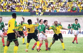  ?? FILE ?? Jamaica’s Reggae Boyz in action against Mexico at the National Stadium in 1997. The teams drew 0-0 meaning that Jamaica qualified for the 1998 World Cup in France.