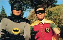  ??  ?? Adam West as Batman and Burt Ward as Robin in the 1960s TV series “Batman.” Ward was just 20 when he took on the role of The Boy Wonder.