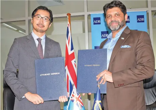  ?? Photo: Ronald Kumar ?? Asian Developmen­t Bank Regional Director of the Pacific Sub-regional Office Masayuki Tachiiri (left), with Attorney-General and Minister for Economy Aiyaz Sayed-Khaiyum after signing the agreement at Ro Lalabalavu House in Suva on May 7, 2020.