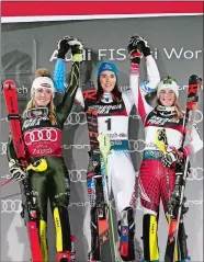  ?? GABRIELE FACCIOTTI/AP PHOTO ?? From left, runner-up Mikaela Shiffrin, winner Petra Vlhova, and third place Katharina Liensberge­r, celebrate on the podium after an alpine skiing women’s World Cup slalom event on Saturday in Zagreb, Croatia.