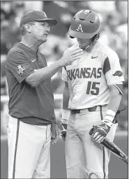  ?? NWA Democrat-Gazette/BEN GOFF ?? Arkansas Coach Dave Van Horn talks to third baseman Casey Martin during a break in the fifth inning against Oregon State in the opening game of the College World Series championsh­ip series June 26 at TD Ameritrade Park in Omaha, Neb. The Razorbacks won 4-1 but lost the series after dropping the second and third games.