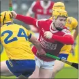  ?? ?? Niall O’Leary, Cork breaks free from the challenge of Clare’s David Conroy during the Allianz Hurling League tie at Cusack Park, Ennis. (Pic: George Hatchell)