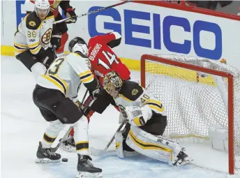  ?? AP PHOTO ?? LAST LINE OF DEFENSE: Tuukka Rask (40) makes one of his 41 saves in front of Zdeno Chara and the Senators’ Alex Burrows during the B’s Game 5 win last night in Ottawa.