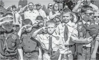  ?? Jake May / Flint Journal via AP file ?? The Boy Scouts of America Board of Directors unanimousl­y approved a vote on Wednesday to welcome girls into its Cub Scout program and to deliver a Scouting program for older girls, allowing them to advance and earn the highest rank of Eagle Scout.