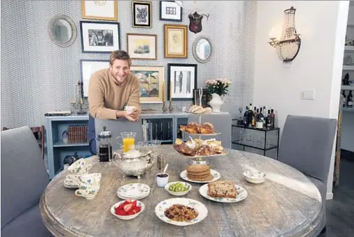  ?? Photograph­s by Glenn Koenig Los Angeles Times ?? CURTIS STONE watched his children progress from sitting in high chairs to feeding themselves to setting the table.