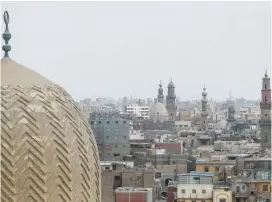  ?? (Amr Abdallah Dalsh) ?? A VIEW OF minarets and houses seen from the top of Cairo’s nearly 1,000-year-old gate of Bab al-Zuweila that is targeted for restoratio­n.