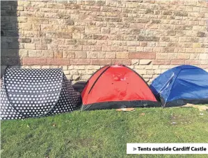  ??  ?? &gt; Tents outside Cardiff Castle
