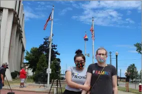  ?? LYRIC AQUINO - THE MORNING JOURNAL FILE ?? Kate Mertes, 19, and Brianna Witta, 31, stand June 24in front of the LGBTQ pride flag in front of city hall.