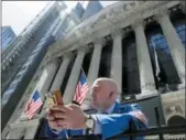  ?? KATHY WILLENS — THE ASSOCIATED PRESS FILE ?? Vincent Pepe enjoys some fresh air outside the New York Stock Exchange, where he works.