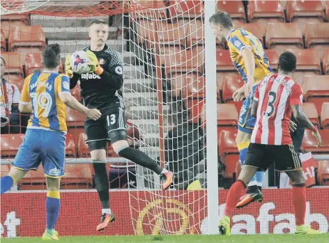  ??  ?? Jordan Pickford comfortabl­y gathers a cross in Wednesday night’s EFL Cup win over Shrewsbury Town at the Stadium of Light. Picture by Frank Reid