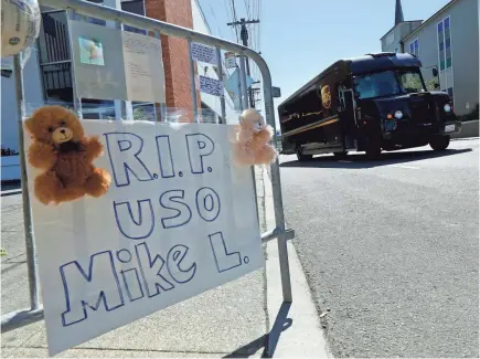  ??  ?? A memorial was set up in June outside a UPS facility in San Francisco for Mike Lefiti, a UPS driver who was slain. One of the people on Lefiti’s route says he always greeted people by name and asked about their families —pets included. Co-worker Jimmy...