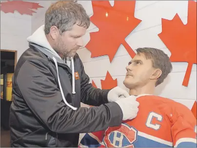  ?? MITCH MACDONALD/THE GUARDIAN ?? Mariner’s Cove operator Matthew Jelley puts the finishing touches on a wax figure of Rocket “Maurice” Richard in the Canada 150 room that was recently installed at the Wax World of the Stars. The Canada 150 room will also see figures of other Canadian...