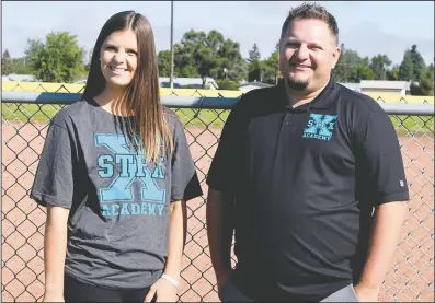  ?? NEWS FILE PHOTO ?? St. Francis Xavier School lead sports academy instructor Kennedy Werre and principal Nick Gale pose for a photo in August while gearing up for the academy’s inaugural year.