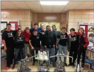  ?? PHOTO COURTESY CHITTENANG­O HIGH SCHOOL ?? Team 7157C, the Bueno Hombres, pose with their robots at the Vex Starstruck Competitio­n at the Northern New York State Championsh­ips at SRC Arena on Saturday, Feb. 18, 2017.