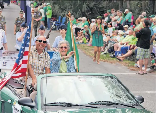  ?? [RAMIE B. LIDDLE] ?? Miss Norma riding with her son, Tim Bauerschmi­dt, in the 2016 St. Patrick’s Day parade in Hilton Head Island, S.C.