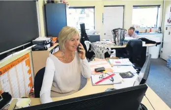  ?? PHOTOS: KERRIE WATERWORTH ?? Team Stalker at work . . . A&P Show event organiser Jane Stalker at her desk in the Upper Clutha A&P Society office. A&P Society president Doug Stalker is in the background.