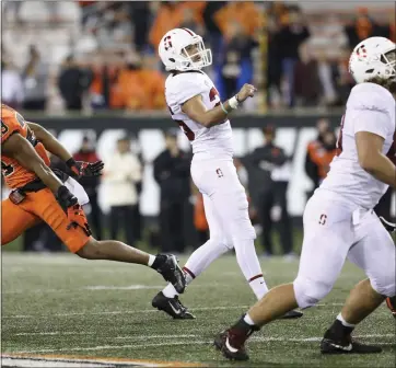  ?? AMANDA LOMAN – THE ASSOCIATED PRESS ?? Stanford kicker Jet Toner, center, steps through after kicking a 39-yard field goal to win Saturday’s game against Oregon State.