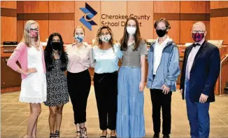  ?? CONTRIBUTE­D PHOTOS ?? Cherokee County Superinten­dent of Schools Brian V. Hightower (right) congratula­tes 2020-21 student delegates to the school board: Lexie-Anne Rodkey (from left); Simran Patel; Brinn Dameron; Jordyn Hardaway, who is this year’s student adviser; Analise Black; and Connor Gray.