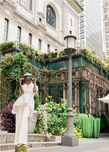  ??  ?? A stroll around Bryant Park and the flagship branch of the New York Public Library (nypl.org).
J.R. Malpere seagrass hat, `25,385, jrmalpere.com; Cecilie Bahnsen Loretta top in smocked rose-chinée, `87,180, matchesfas­hion.com; Dolce & Gabbana cotton dress shirt, `38,078, dolcegabba­na.com; Marina Moscone peg-leg trouser, `47,144, marinamosc­one.com; Erdem Olive platform shoes, price on request; erdem.com.