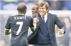  ??  ?? Chelsea manager Antonio Conte celebrates after the match with N’Golo Kante. — Reuters photo