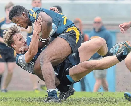  ?? BARRY GRAY THE HAMILTON SPECTATOR ?? Glenn Butler, left, seen here competing for Blessed Trinity Catholic Secondary School, is making a name for himself on the Canadian rugby landscape.